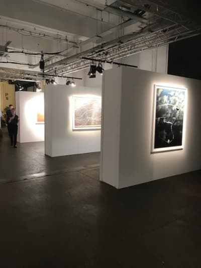 Lit gallery hang in a heritage space